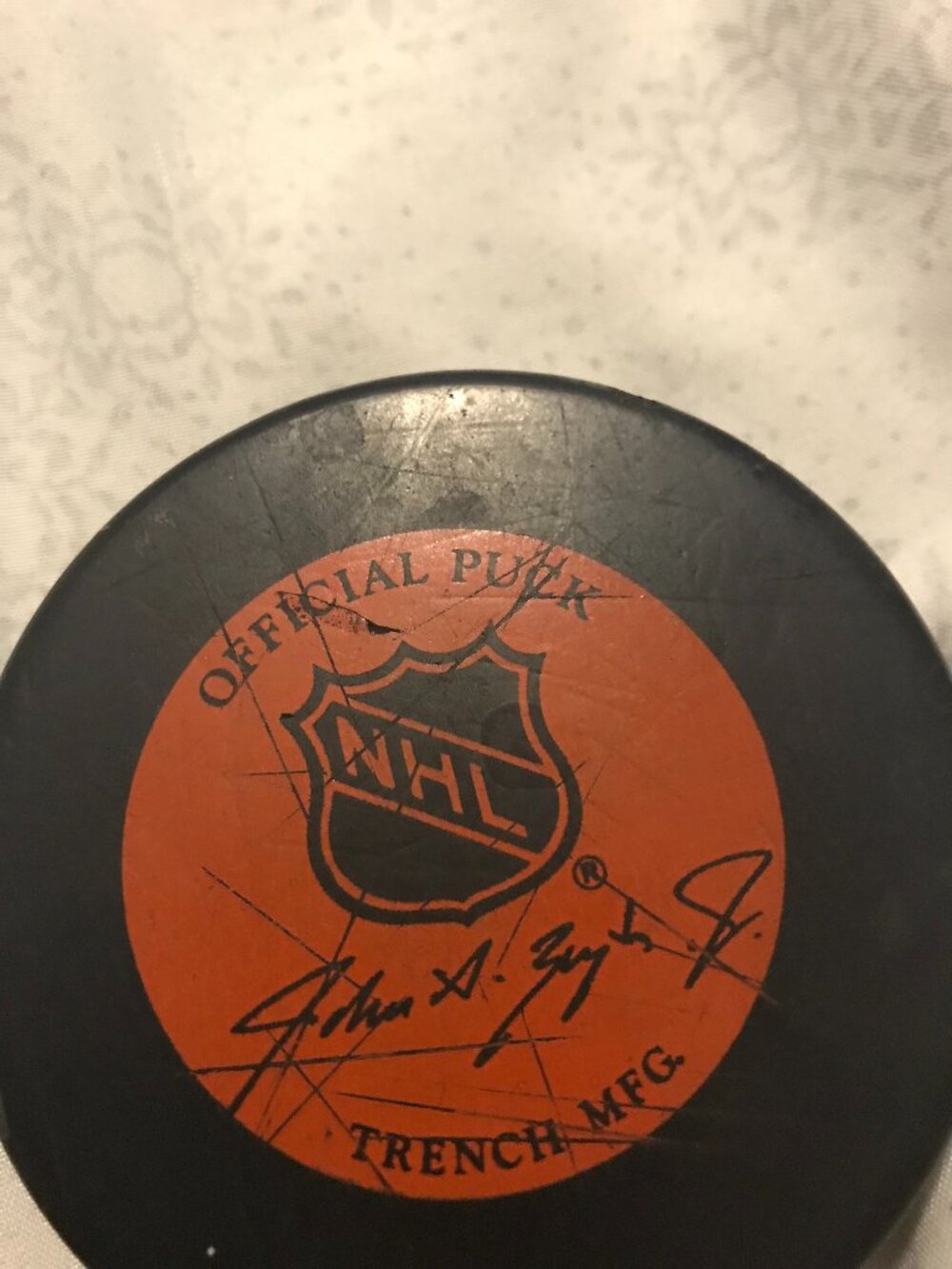 Official NFL puck used in a game with game wear marks, signed.